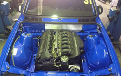 Engine bay of RX Automotive blue E30